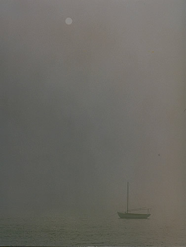 Sun Shining On One Boat In The Fog