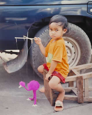 Child With A Pink Puppet